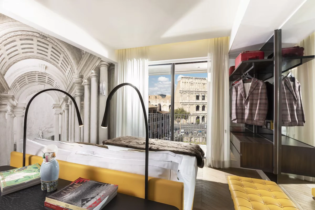 Palazzo Manfredi Grand View Gallery Suite bedroom with the Colosseum visible through the window