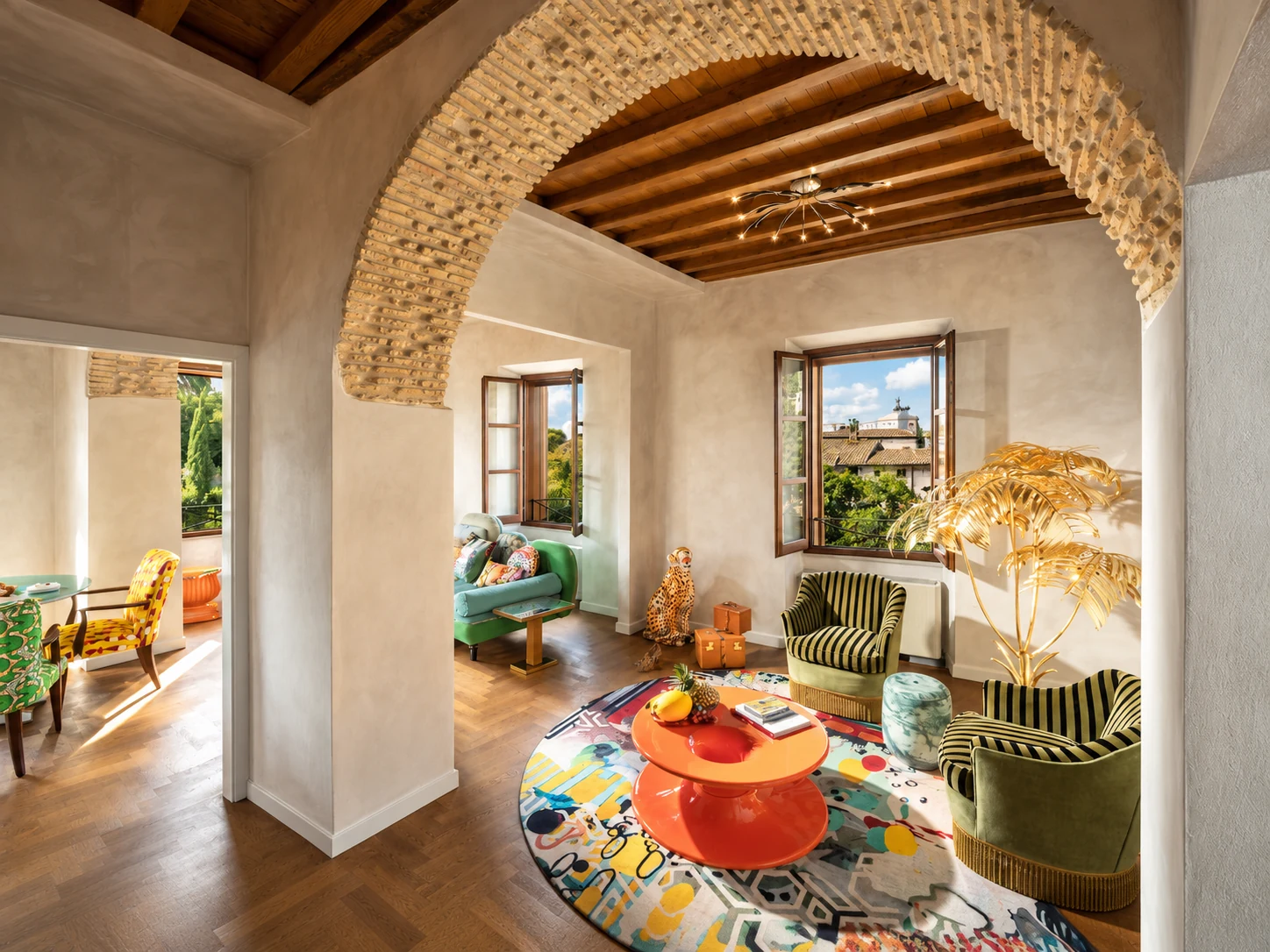 Palm Suite Rome living area with historic brick arch and colorful designer furnishings
